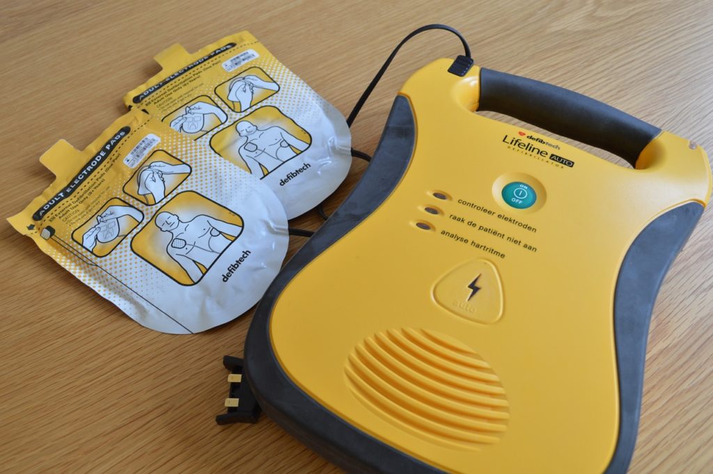 Yellow AED on table 