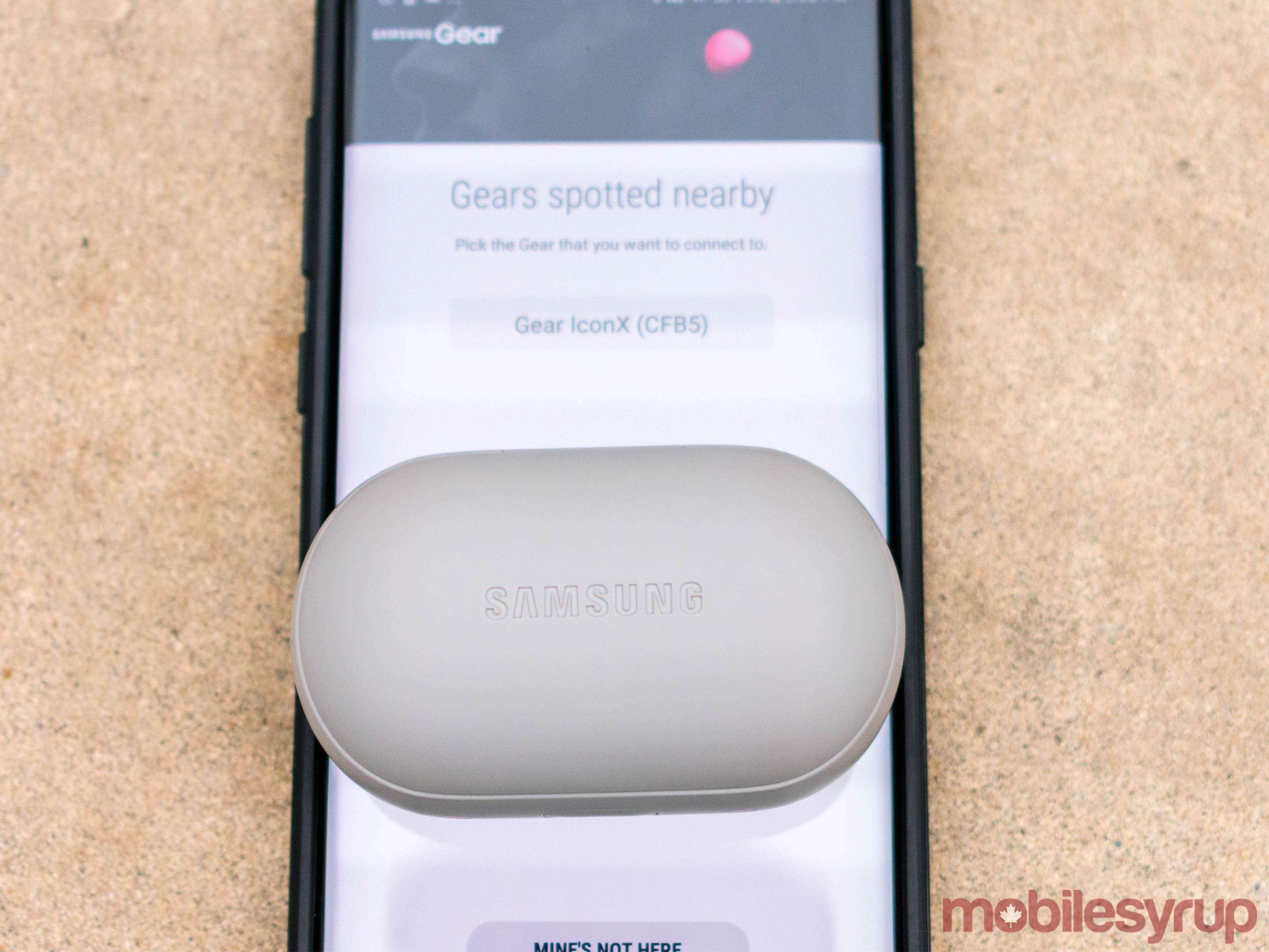 Gear IconX charging case on Samsung Galaxy S8+