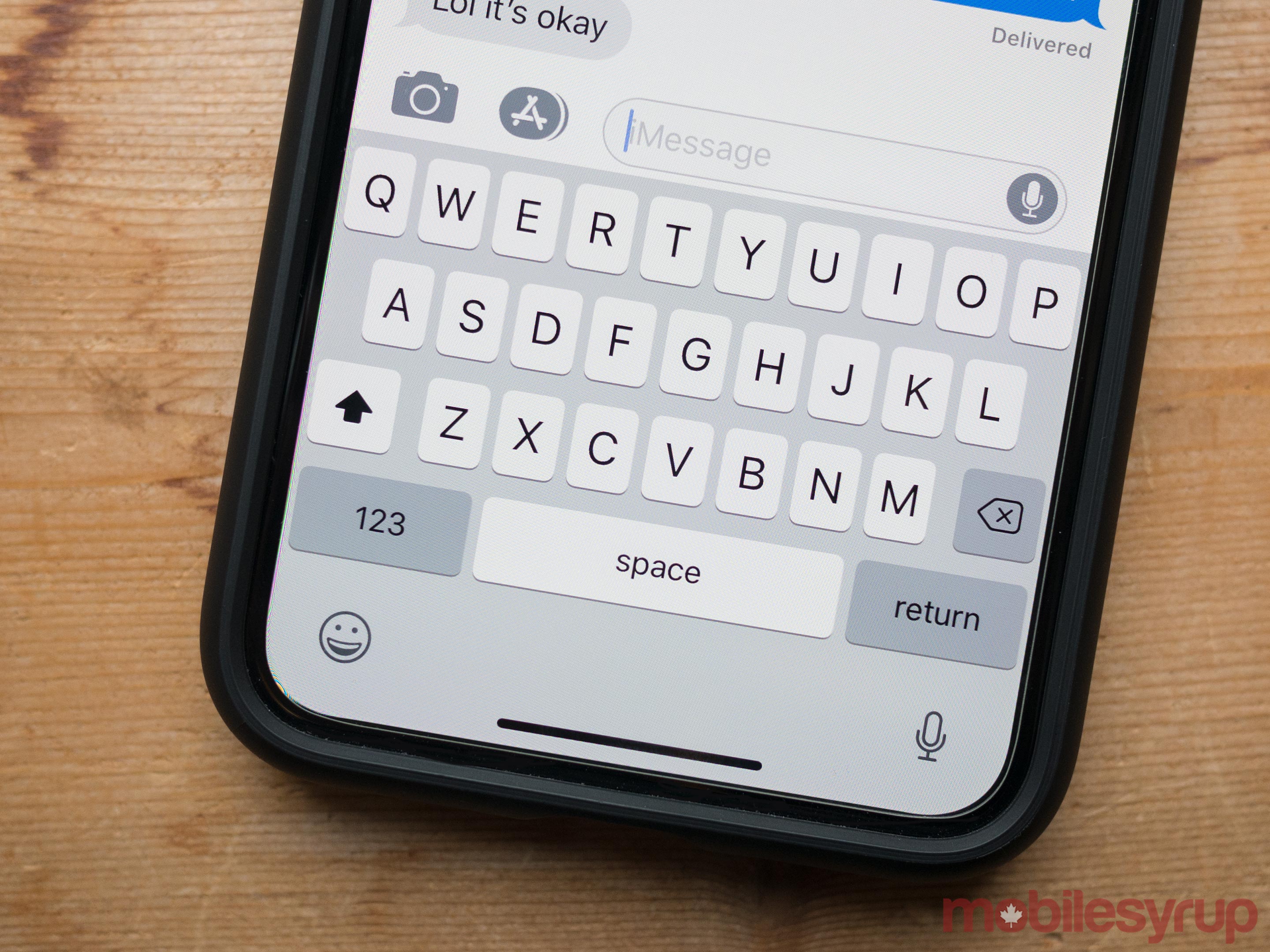 The iOS keyboard on an iPhone X -- a device without a physical home button