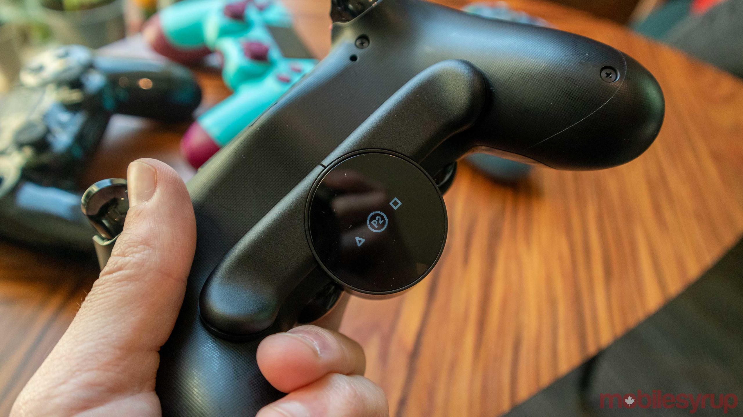 button on back of ps4 controller